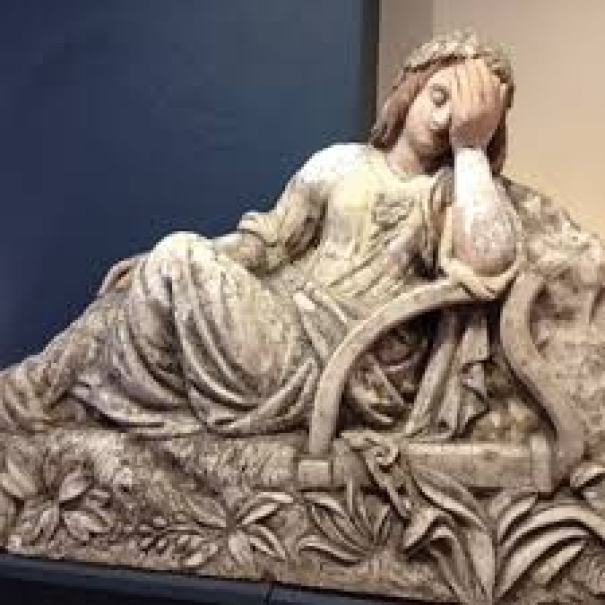 The Maid of Erin, by Burnett, shown weeping in despair with her harp in bondage, evoking the plight of her country and its people.
